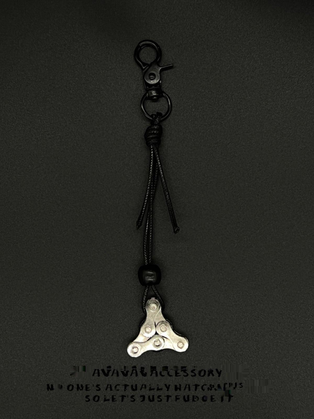 Decorative motorcycle chain keychain by Bean's Moto Booth featuring a detailed chain design for motorcycle enthusiasts.
