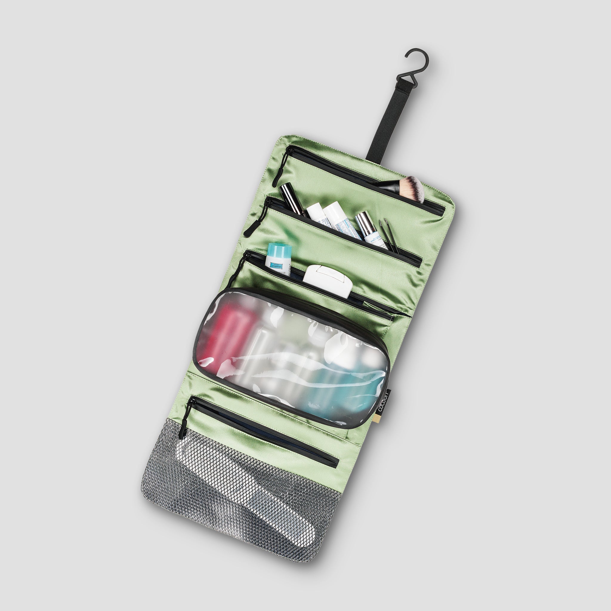 Inside view of COCOON Minimalist Hanging Toiletry Kit Monsoon Silk™, showing compartments and organization for travel essentials.