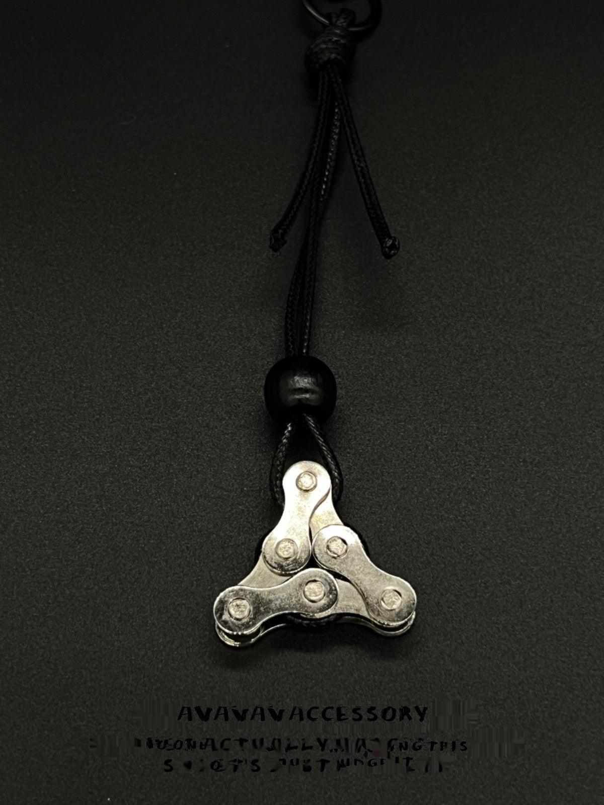 Motorcycle chain keychain decor by Bean's Moto Booth featuring a metal chain design with biker-inspired style.