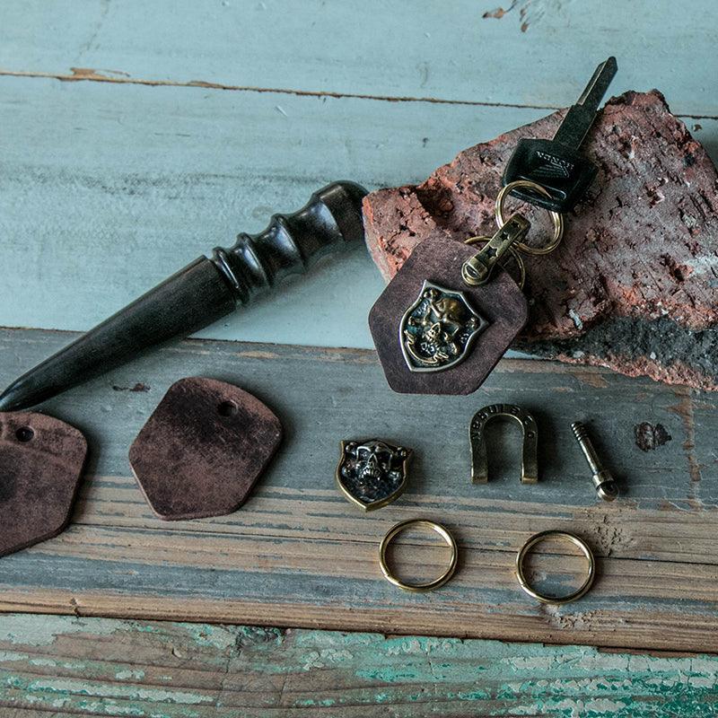 Handcrafted leather heavy metal motorcycle keychain decor with metal accents, from Bean's Moto Booth.