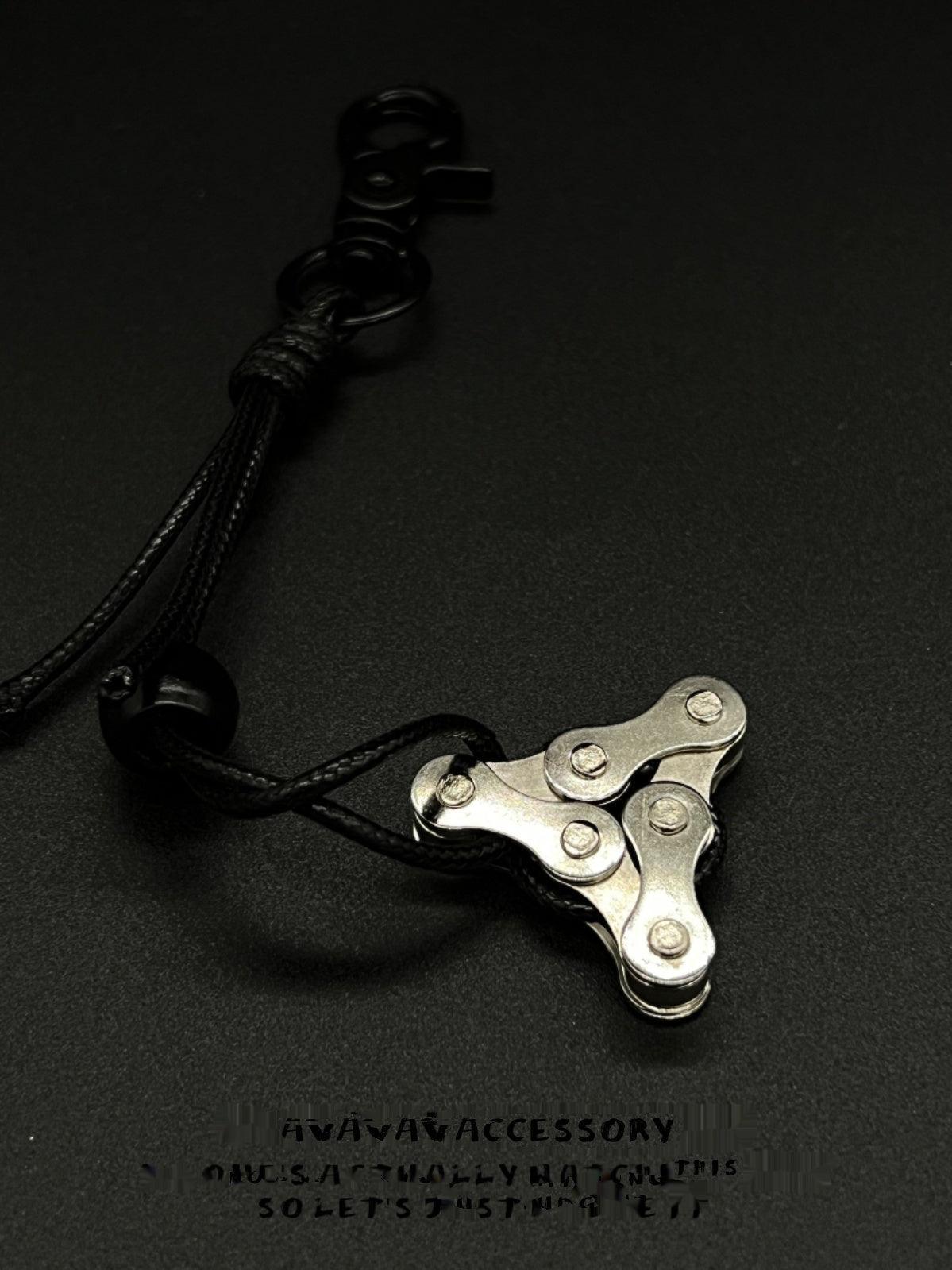 Decorative motorcycle chain keychain from Bean's Moto Booth featuring a detailed metal chain design.