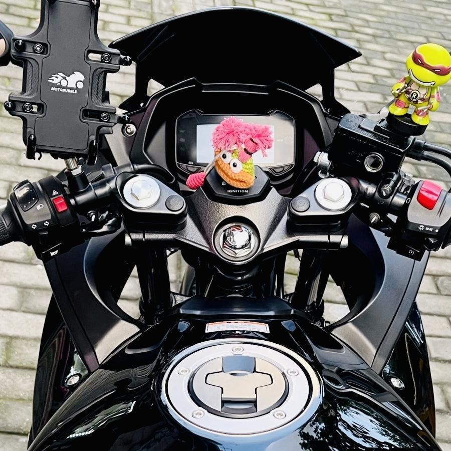 Decor image of a quirky cute motorcycle key cover from Bean's Moto Booth featuring colorful, playful motorcycle-shaped key decor.