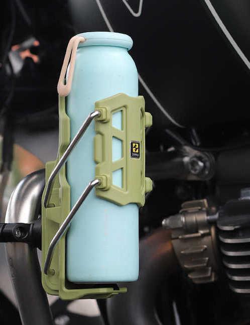 Bean's Moto Booth SMNU™ motorcycle adaptive anti-slip water bottle holder attached to motorcycle handlebar, featuring secure water bottle grip.