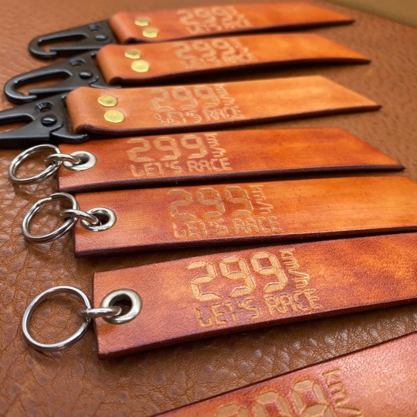 Leather motorcycle keychain with "299KM/h Top-Speed" design, handmade decor from Bean's Moto Booth, featuring detailed leather craft.