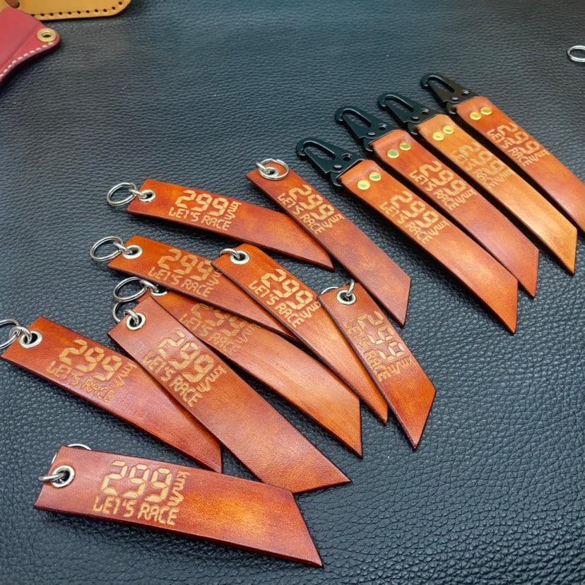 Leather motorcycle keychain by Bean's Moto Booth featuring a 299KM/h top-speed design, decorative and handcrafted.
