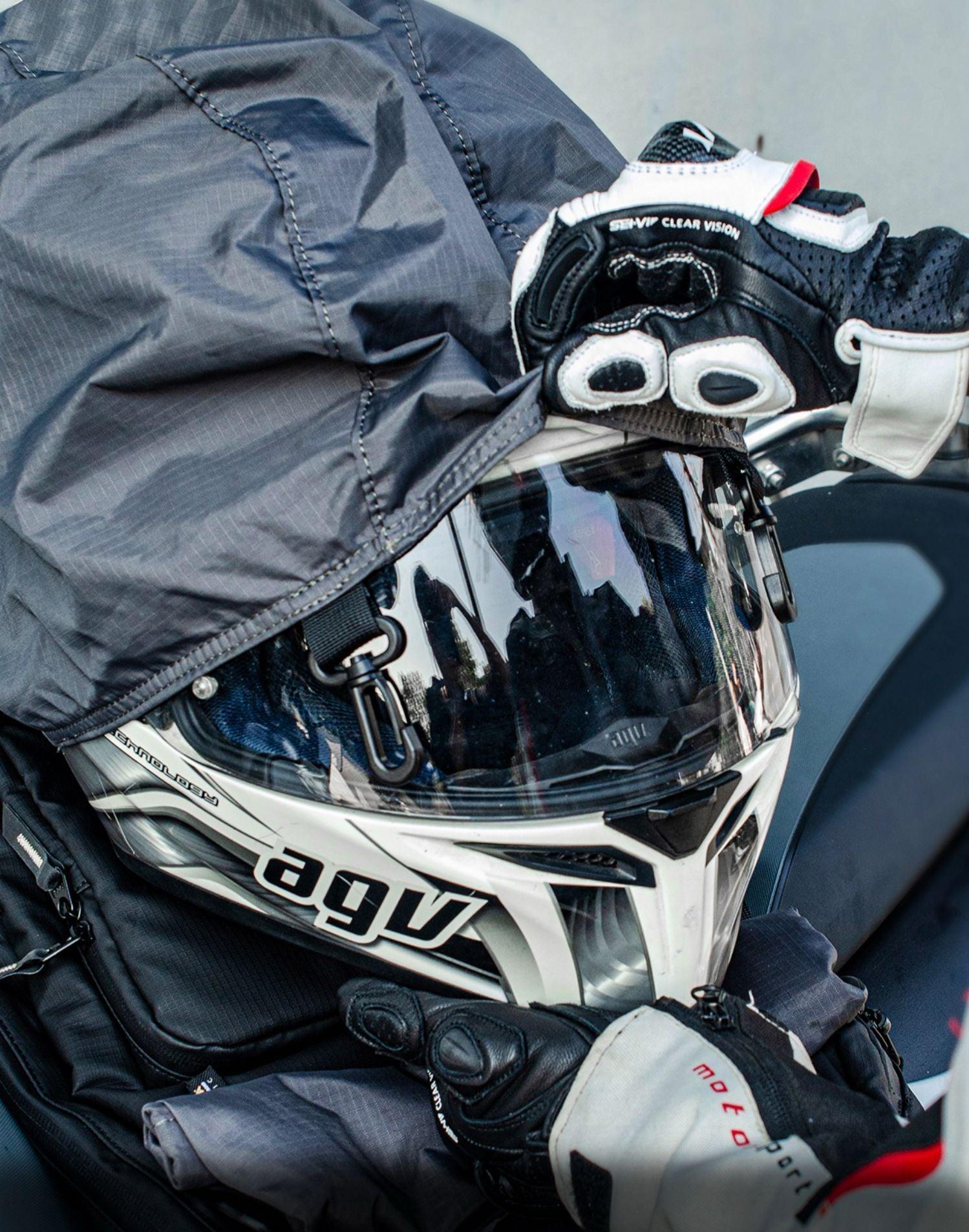 Seivi™ motorcycle touring tactical camping backpack in black with multiple compartments, mounted on motorcycle saddlebag.