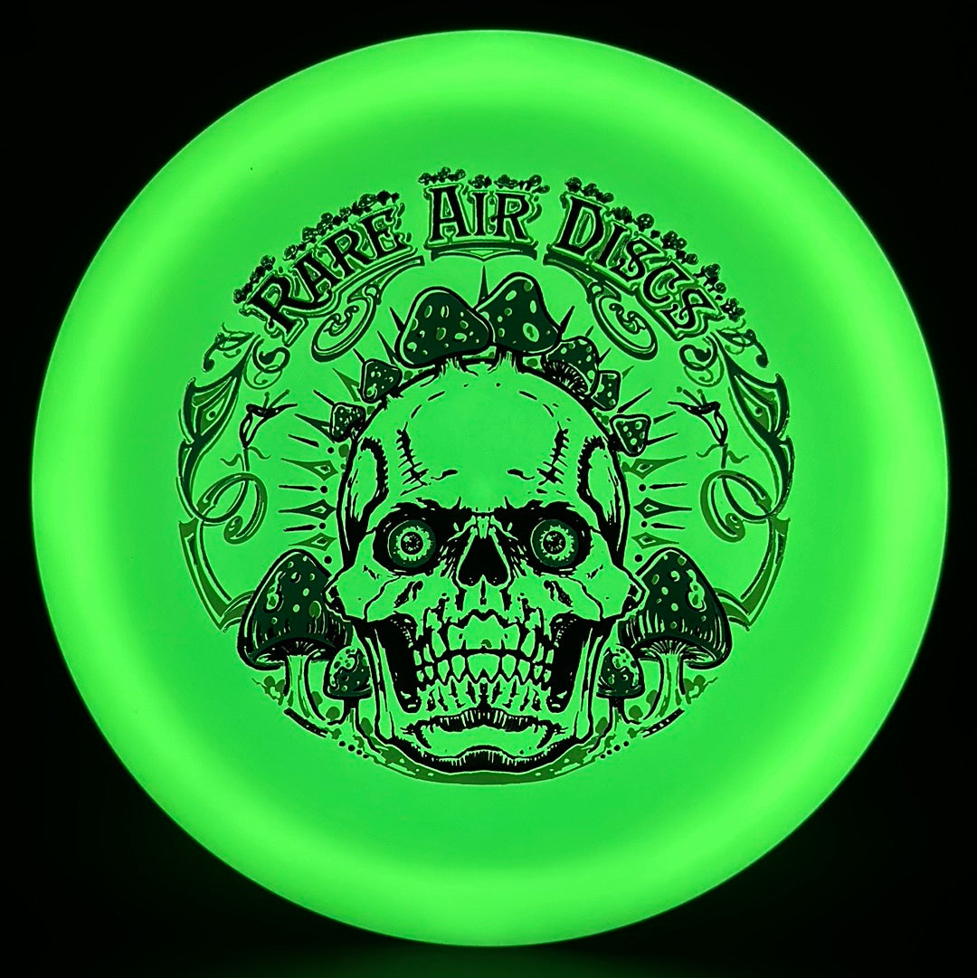 Forged Radiant Era Crushin' Amanitas disc golf stamp by Manny Trujillo on a Rare Air Discs disc with vibrant artwork and detailed design.