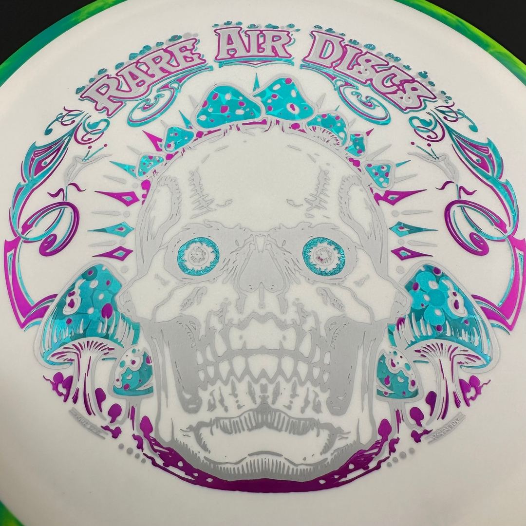 Fission Defy Crushin' Amanitas VIP 2.0 disc golf disc by Rare Air Discs, featuring vibrant design and detailed stamp.