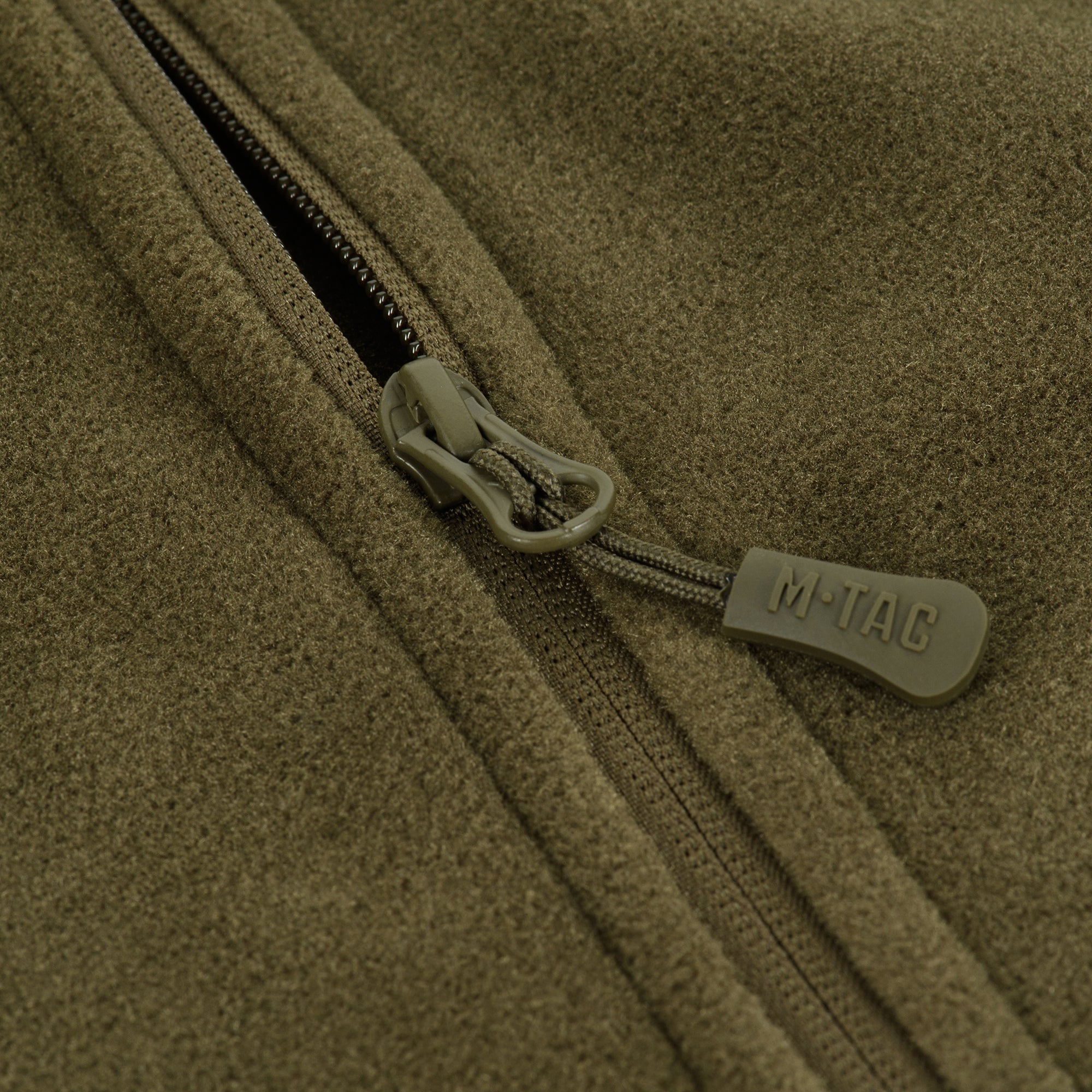 M-TAC Nord Polartec fleece jacket in a rugged outdoor setting, showcasing its warmth and comfort.