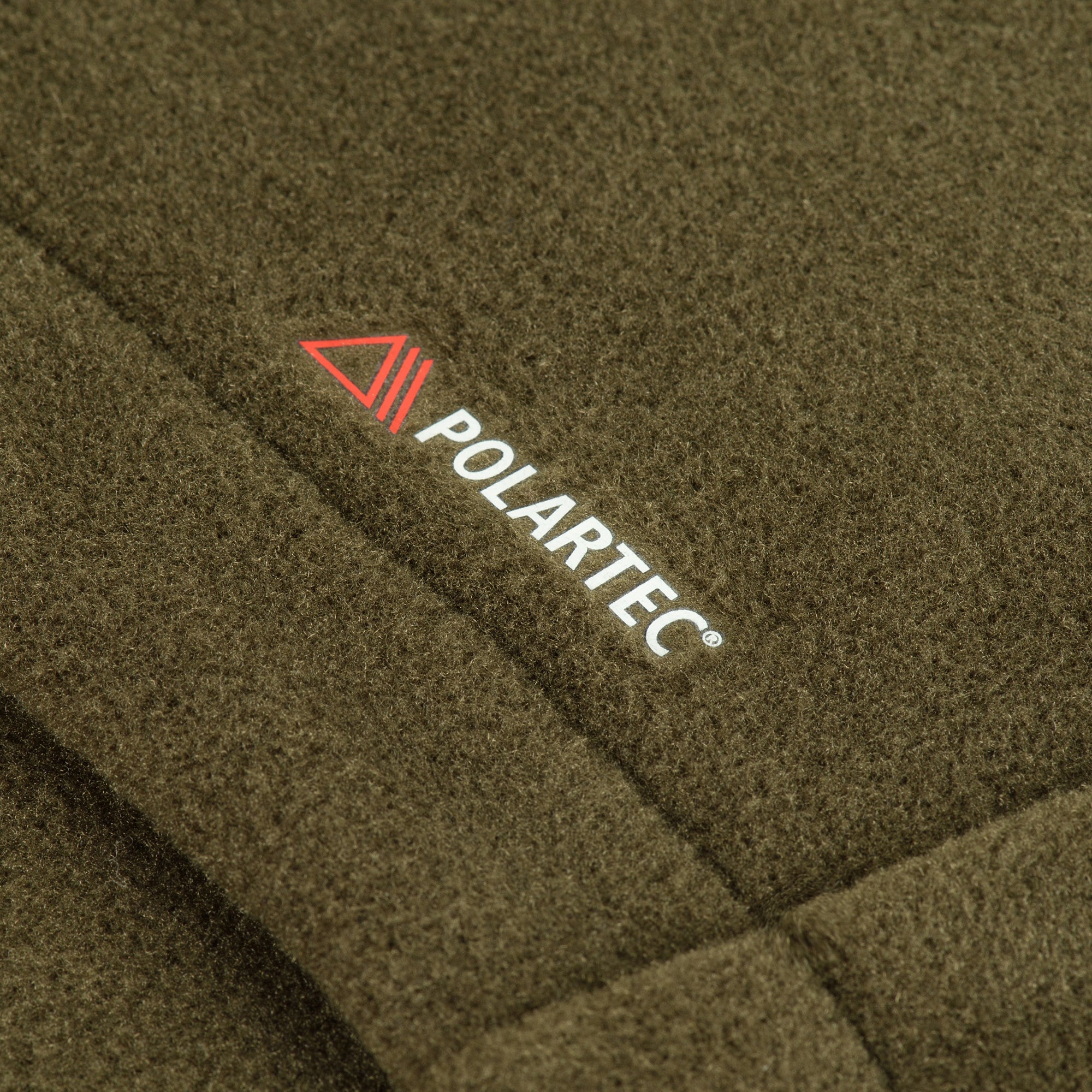M-TAC Nord Polartec fleece jacket in dark color, showcasing soft fabric and zippered front, ideal for outdoor activities.