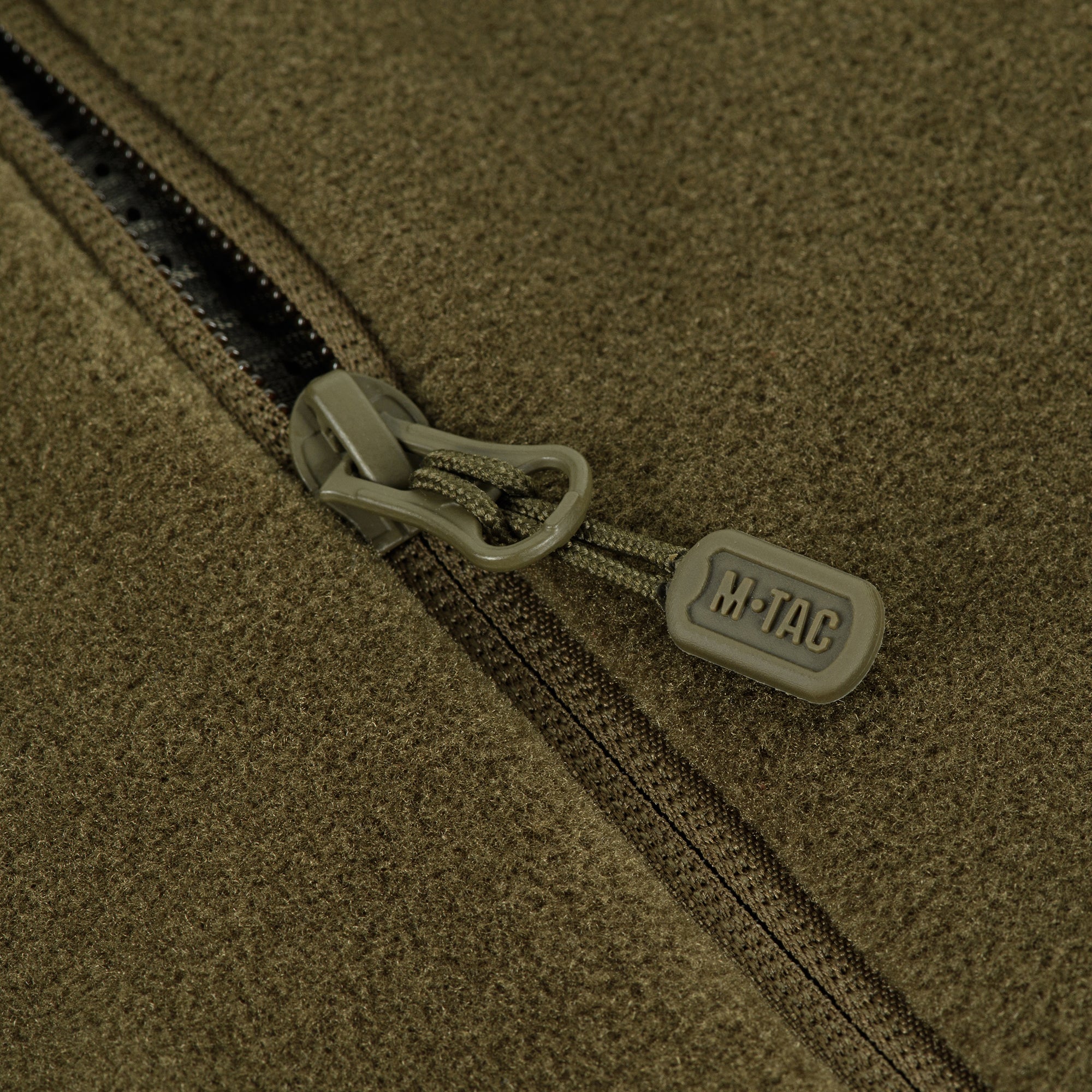 M-TAC Nord Polartec fleece jacket in dark color, showcasing a soft, textured fabric and zippered front design.