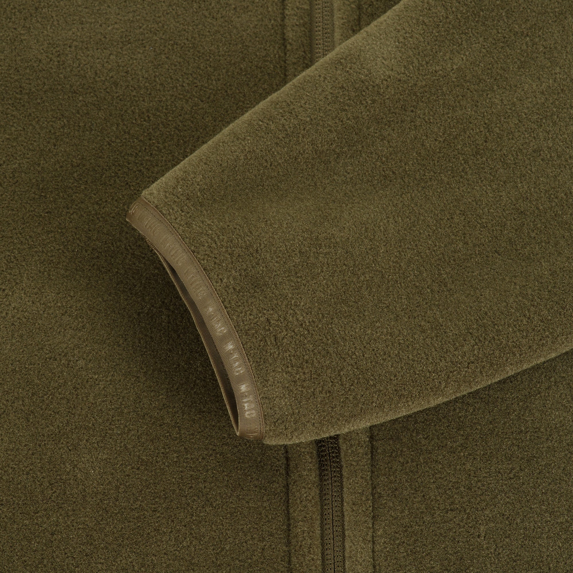 M-TAC Nord Polartec fleece jacket in dark color, showcasing soft fabric and zippered front, ideal for outdoor activities.