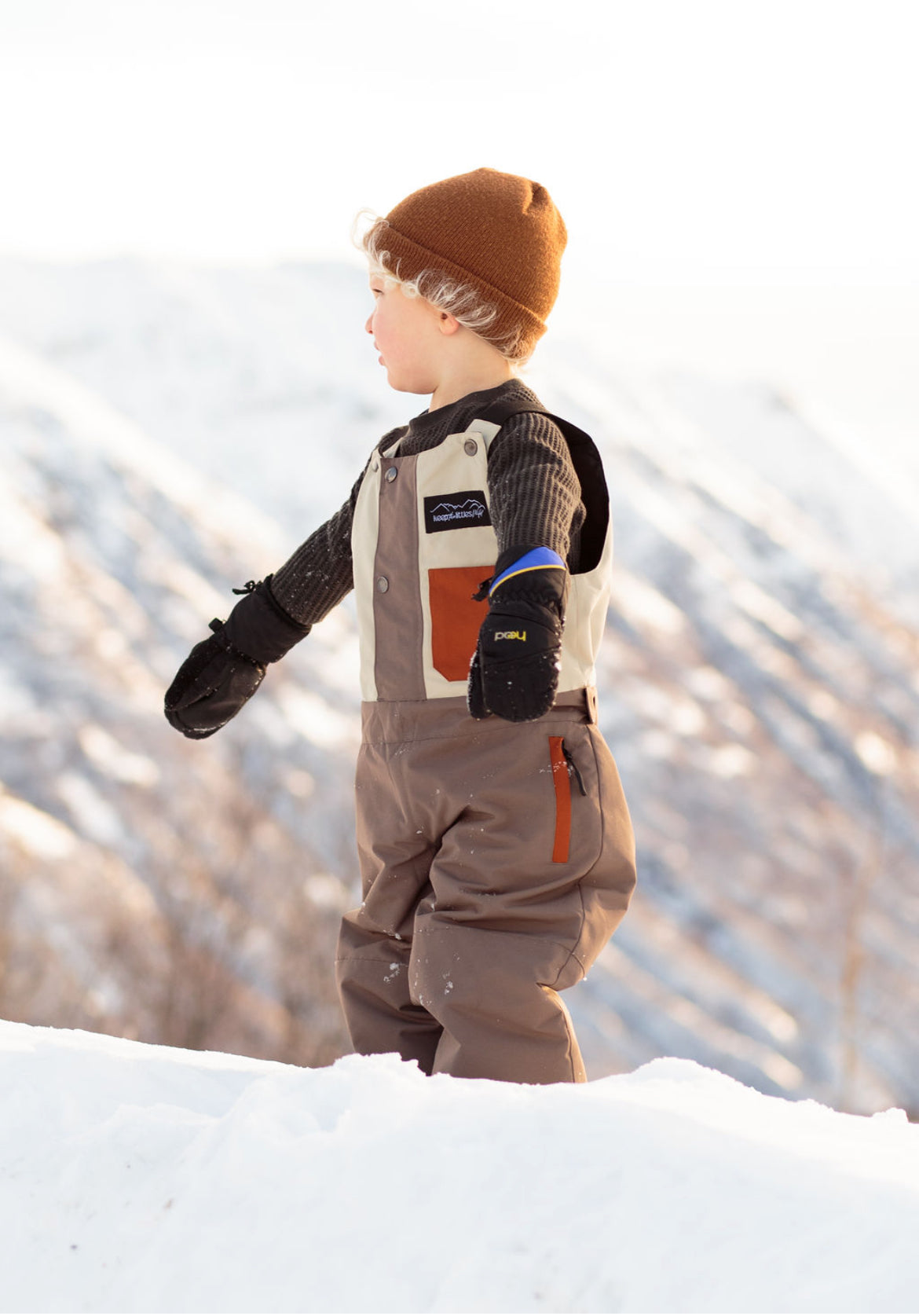 Youth waterproof snow bib by Keep the Littles Wild, featuring adjustable straps and snow-resistant fabric for winter play.
