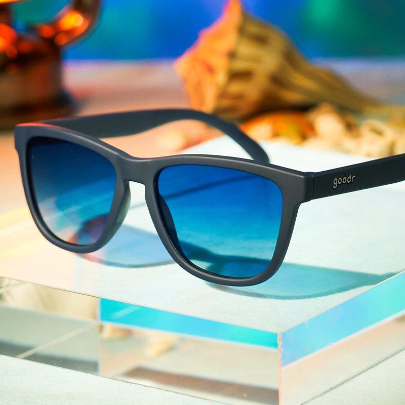 Rare Air Discs Drinks Seawater OG polarized sunglasses with sleek black frames and mirrored lenses, displayed in packaging.