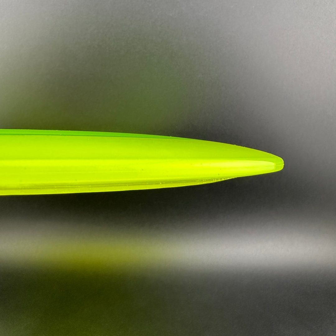 Close-up of Rare Air Discs Gummy C-Blend Aztec disc golf disc from the Fear V1 series by Les White, featuring vibrant colors and logo.