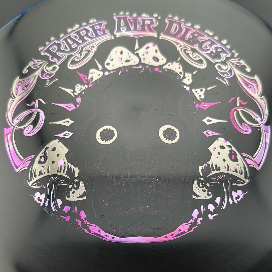 Disc golf disc from Rare Air Discs, Halo S-Blend Tomb Crushin' Amanitas stamp by Manny Trujillo, featuring vibrant design and branding.