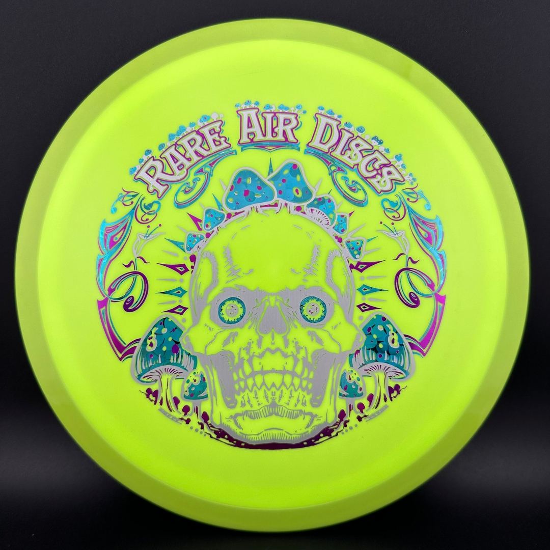 Rare Air Discs Fission Defy Crushin' Amanitas VIP 2.0 disc golf disc by Manny Trujillo on white background.