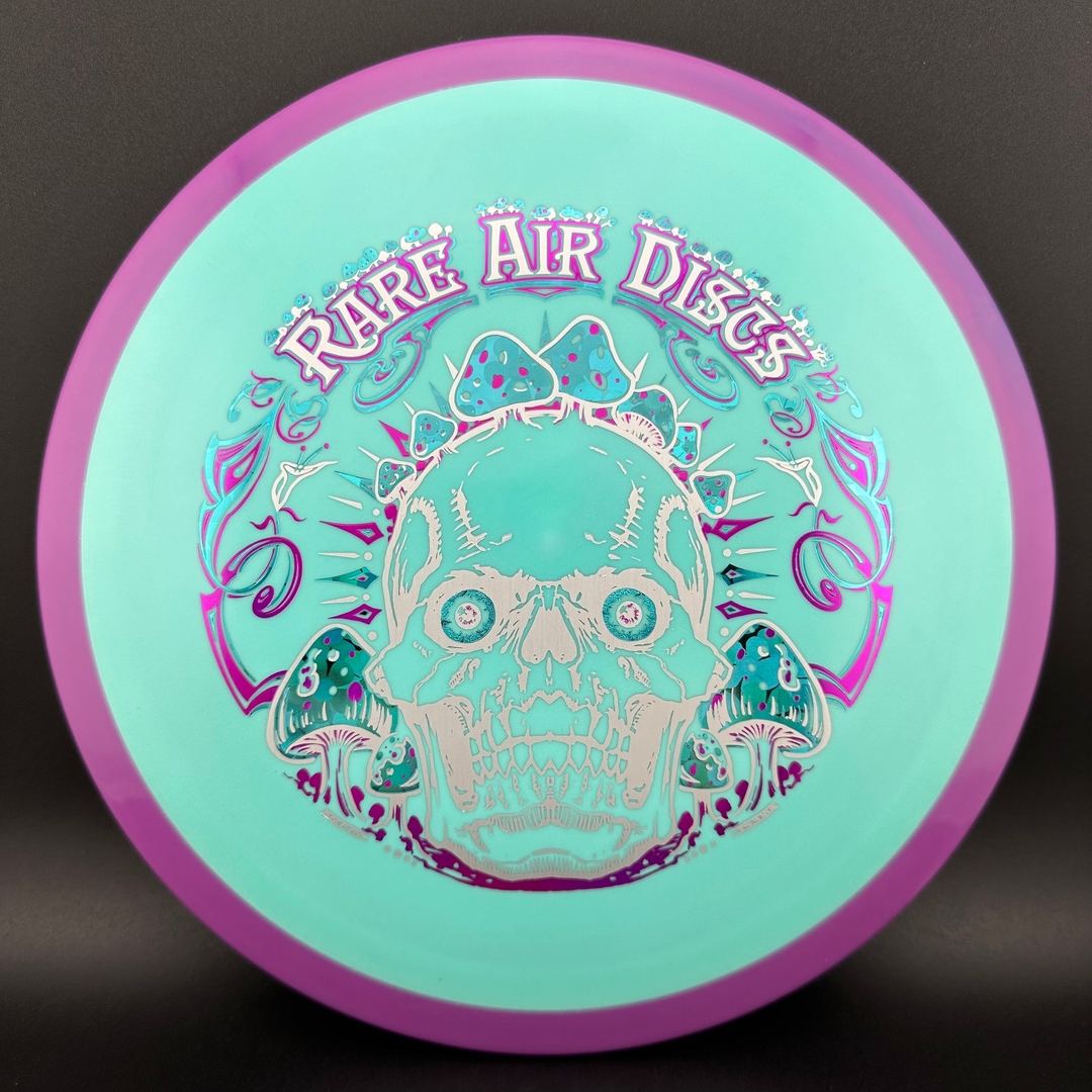Fission Defy Crushin' Amanitas VIP 2.0 disc golf disc by Rare Air Discs, showing vibrant design and branding on the disc surface.
