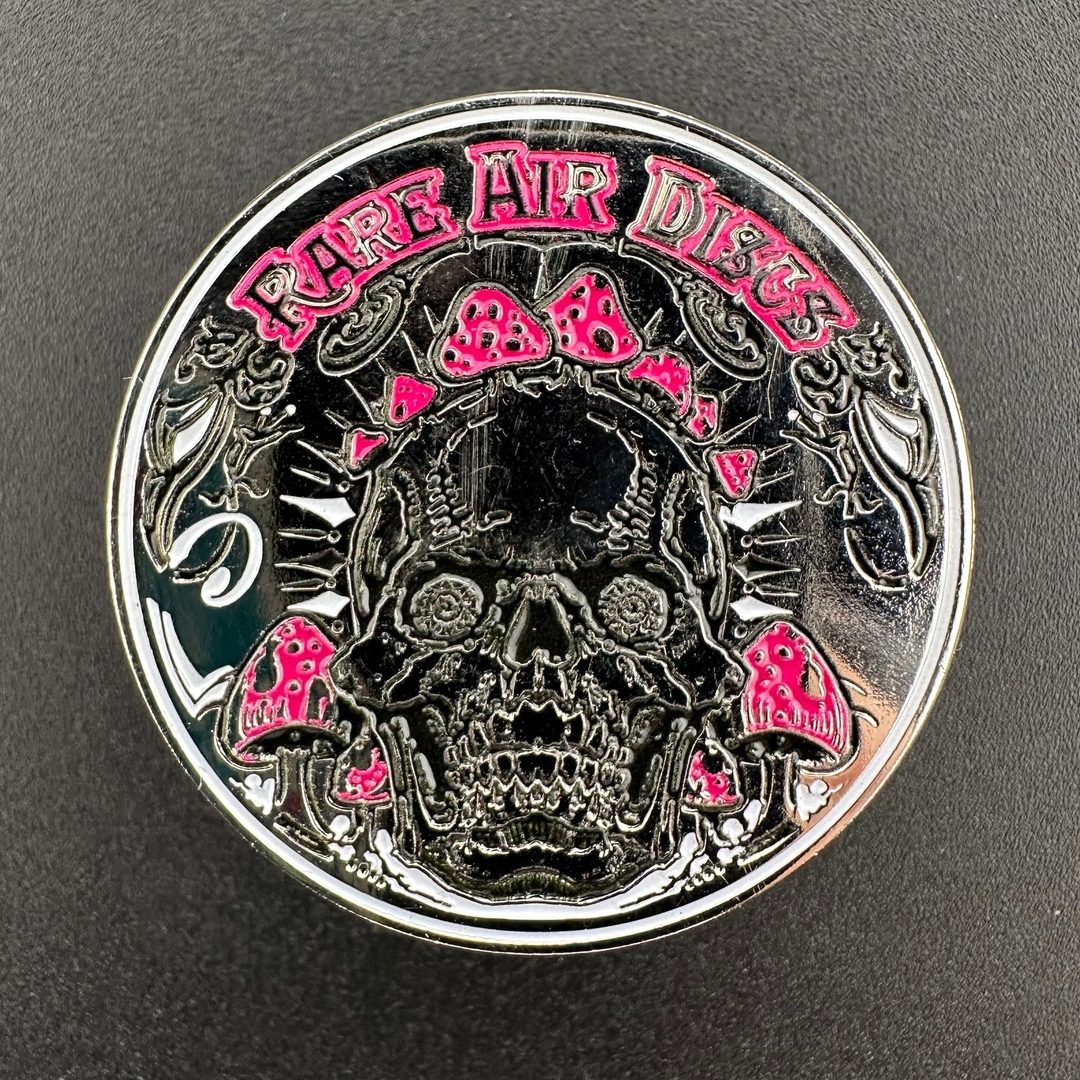 Rare Air Discs Crushin' Amanitas pin in two color options, featuring detailed mushroom design on a metal accessory.