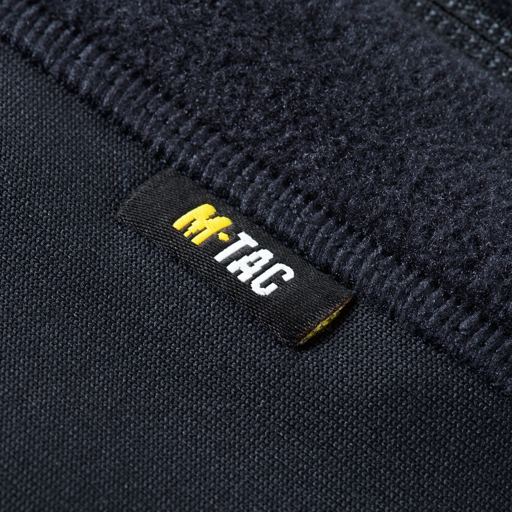 M-TAC Fleece Jacket in Polartec fabric, showcasing a sporty design and warm, soft texture ideal for outdoor activities.