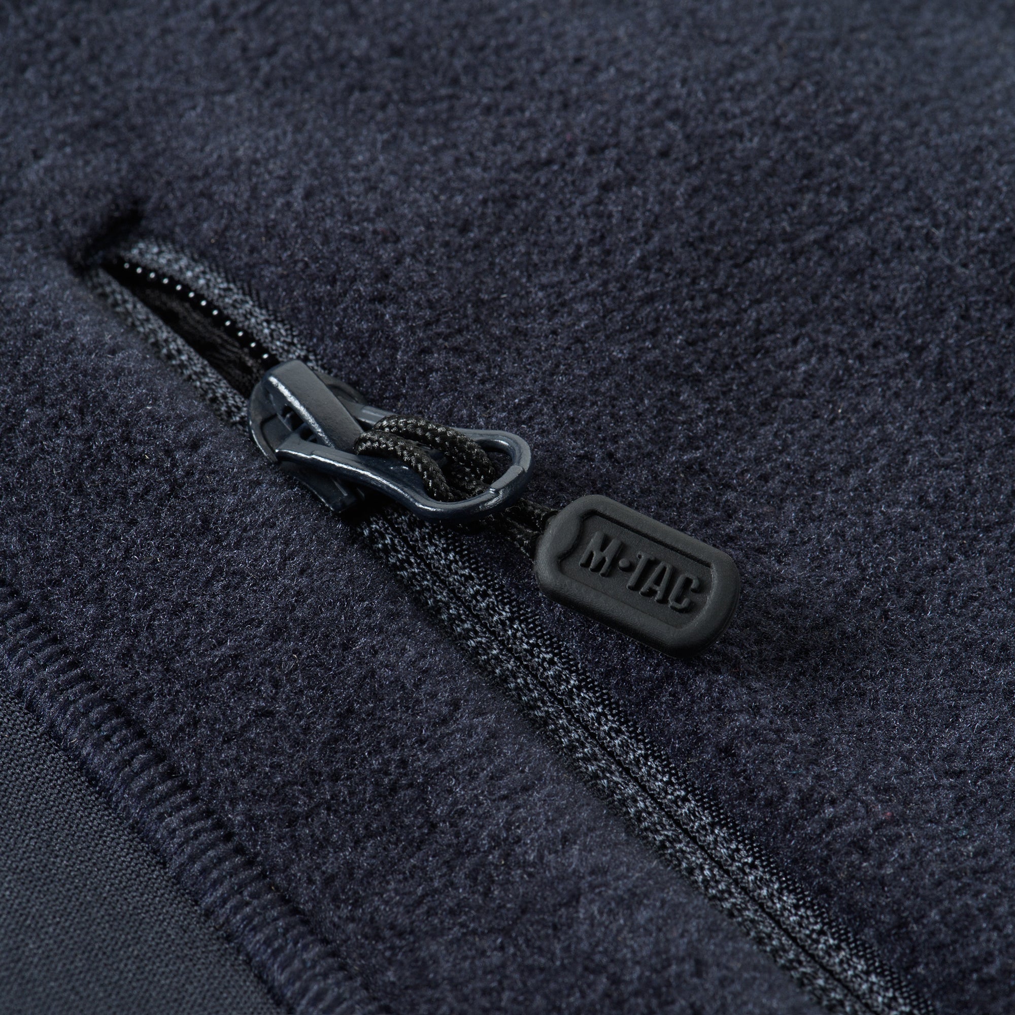 M-TAC Fleece Jacket in Polartec fabric, showcasing a sporty design and functional features for outdoor activities.