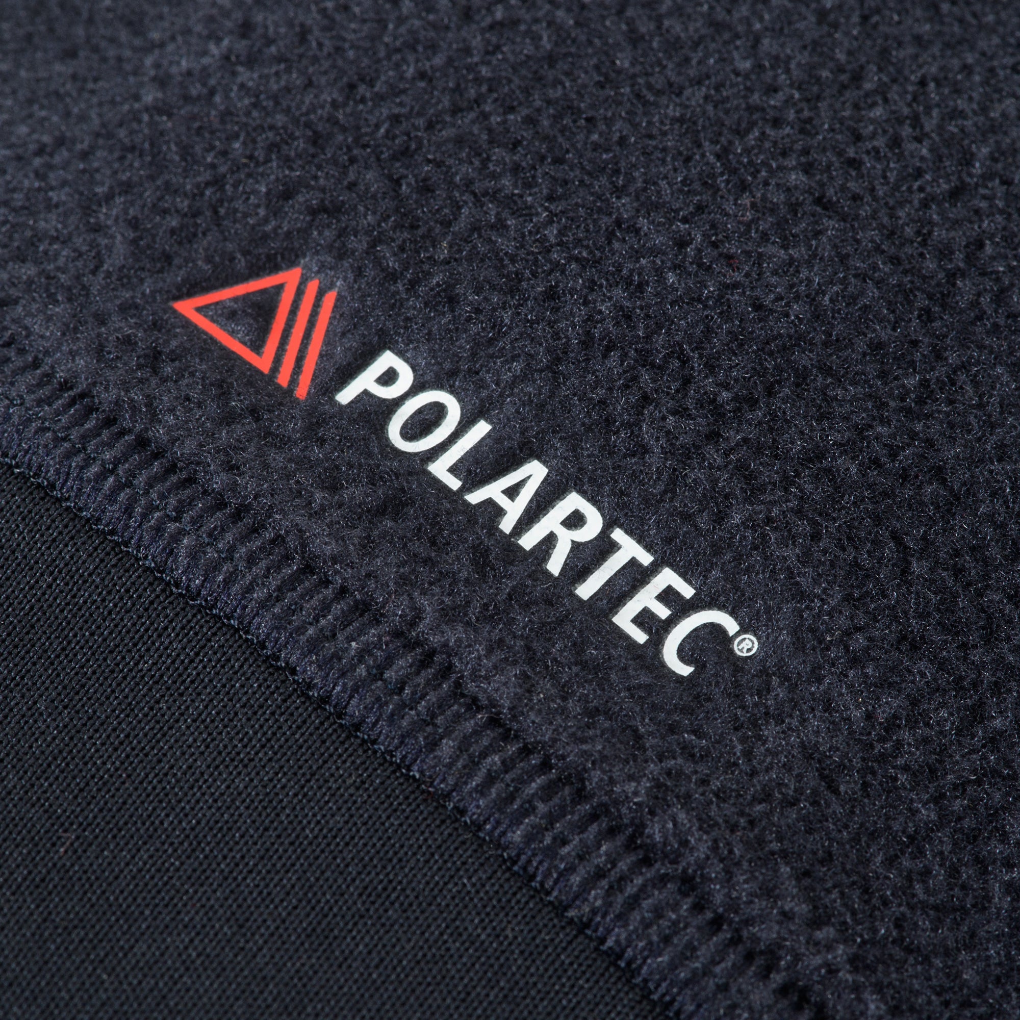 M-TAC Polartec fleece jacket in dark color, showcasing a soft texture and practical design for outdoor activities.