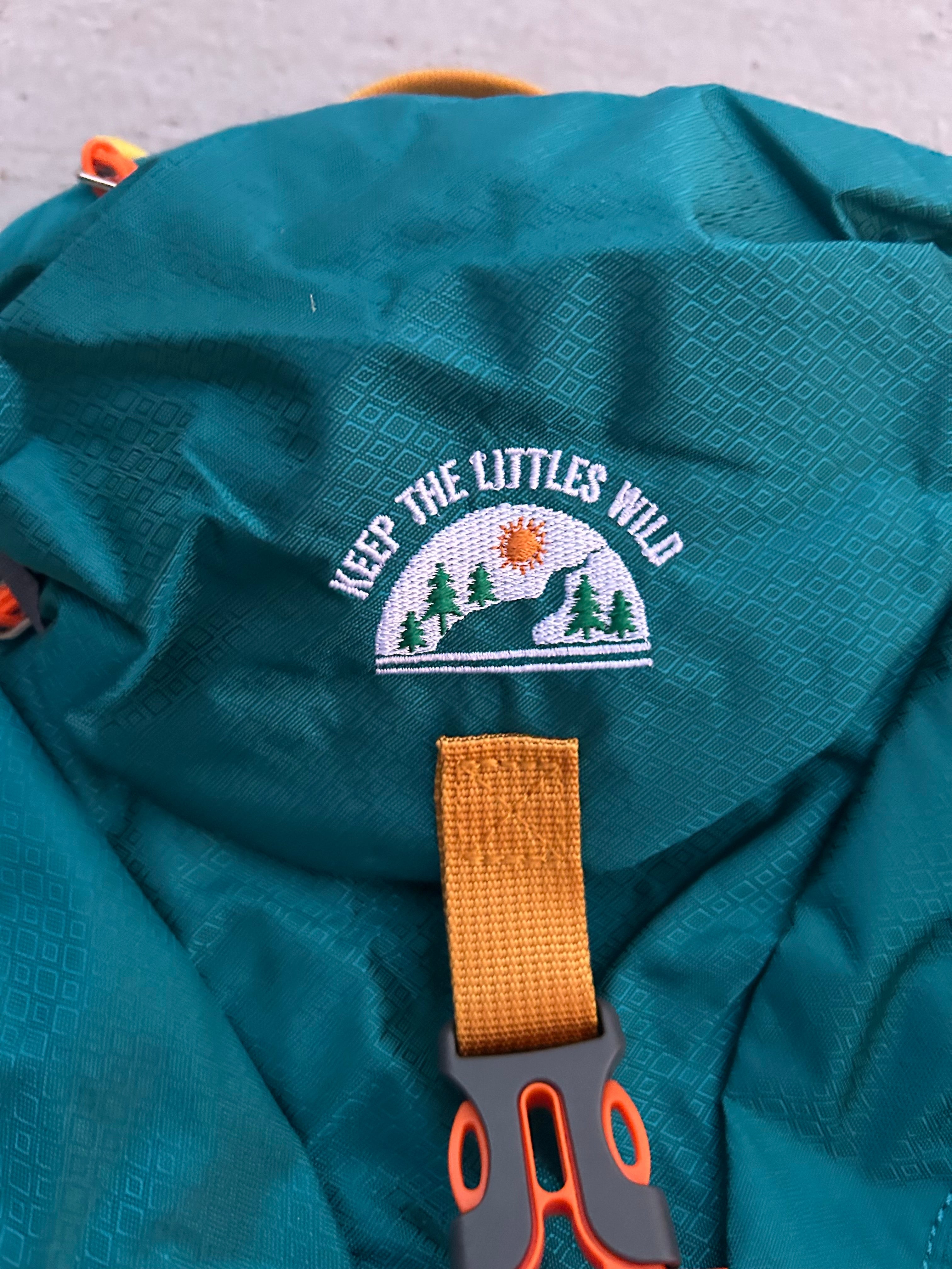 Keep the Littles Wild teal kids' hiking backpack with water bladder compartment, suitable for ages 2 to 7, outdoors adventure gear.
