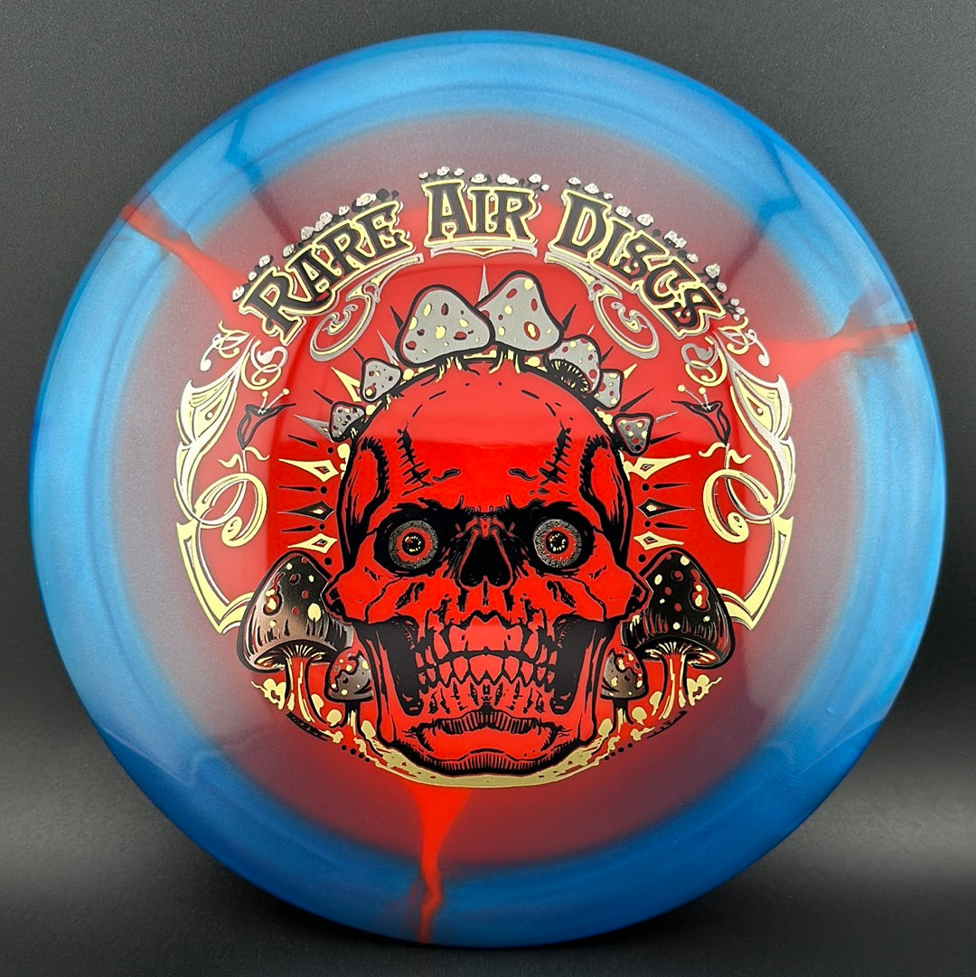Rare Air Discs Halo S-Blend Conqueror disc golf disc in crushin' amanitas design, featuring vibrant green and earthy tones.