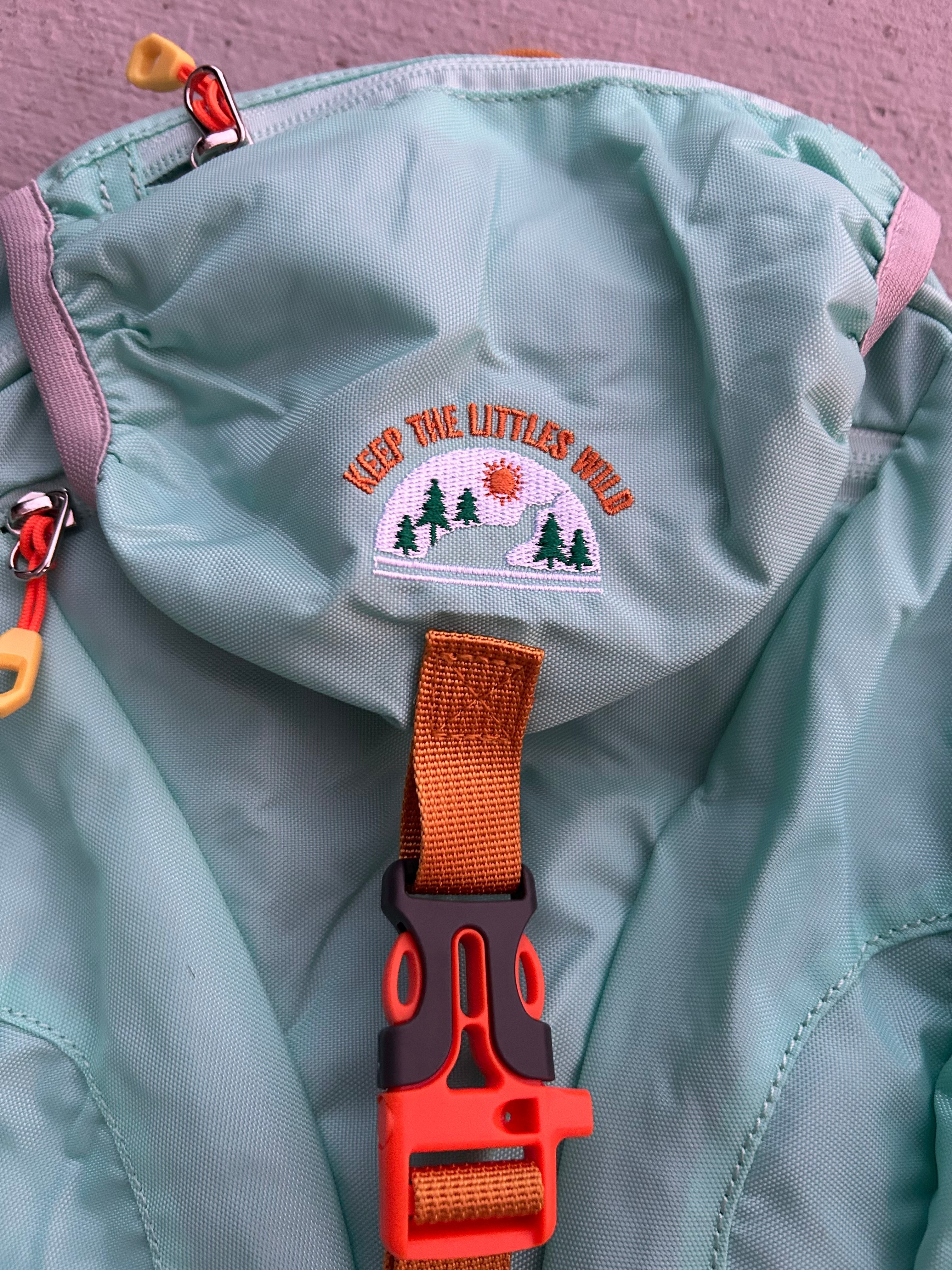 Light blue kids' hiking backpack by Keep the Littles Wild with water bladder system for young hikers aged 2 to 7.