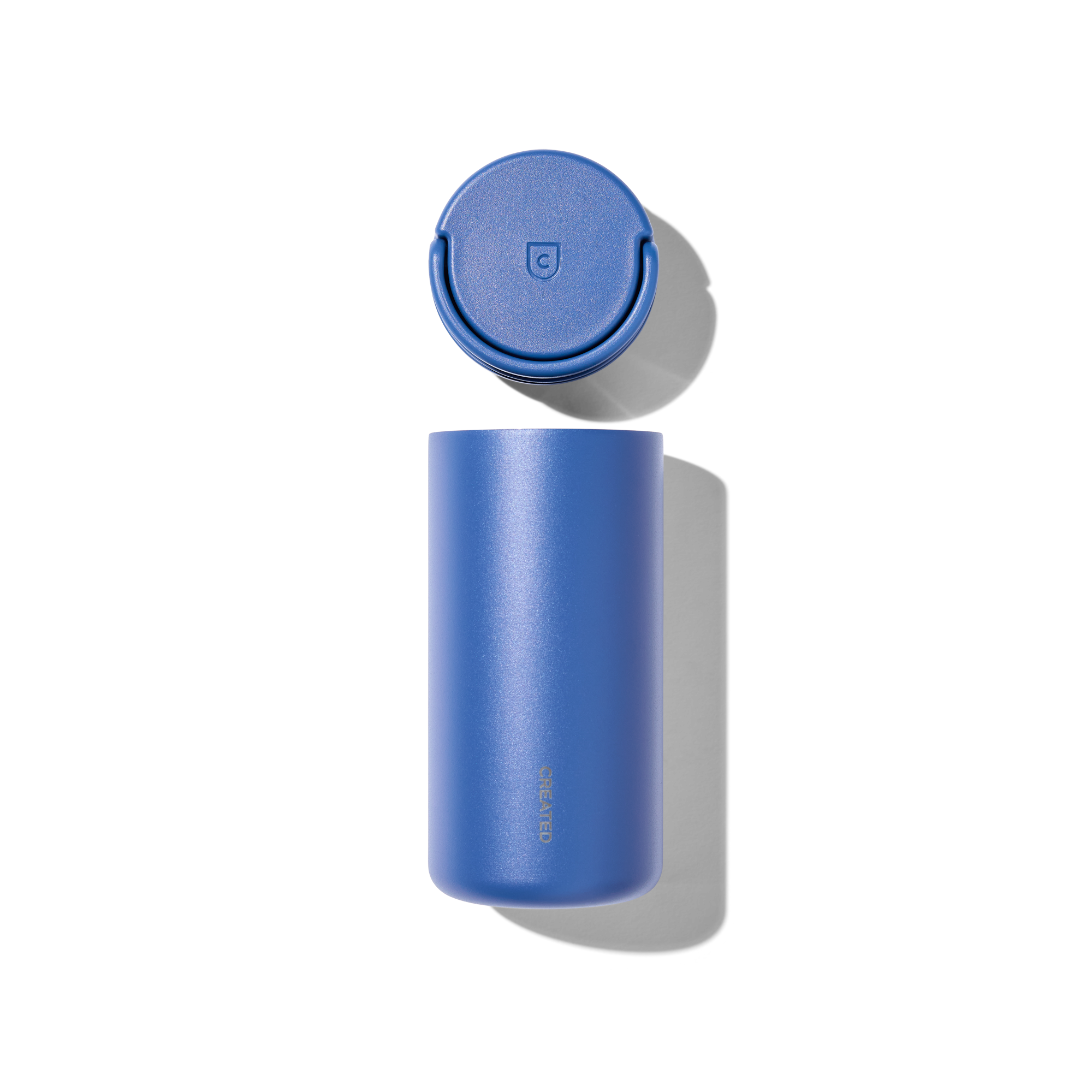 Created Co. 12oz Nomad Grip Tumbler in Pacific Blue with textured grip and stainless steel body, ideal for hot and cold drinks.