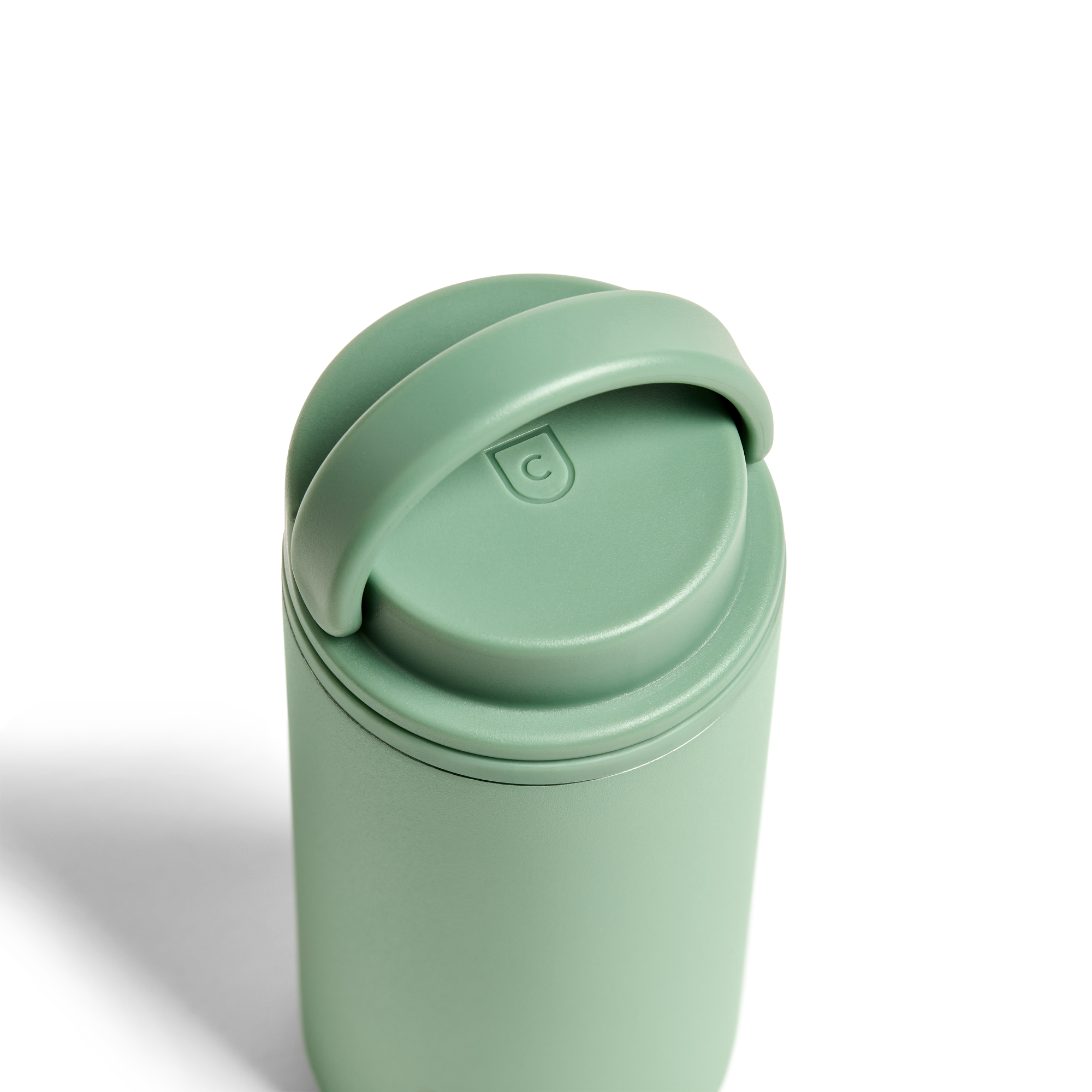 Sage green 12oz Nomad Grip Tumbler by Created Co. with textured grip and stainless steel body for hot and cold beverages.