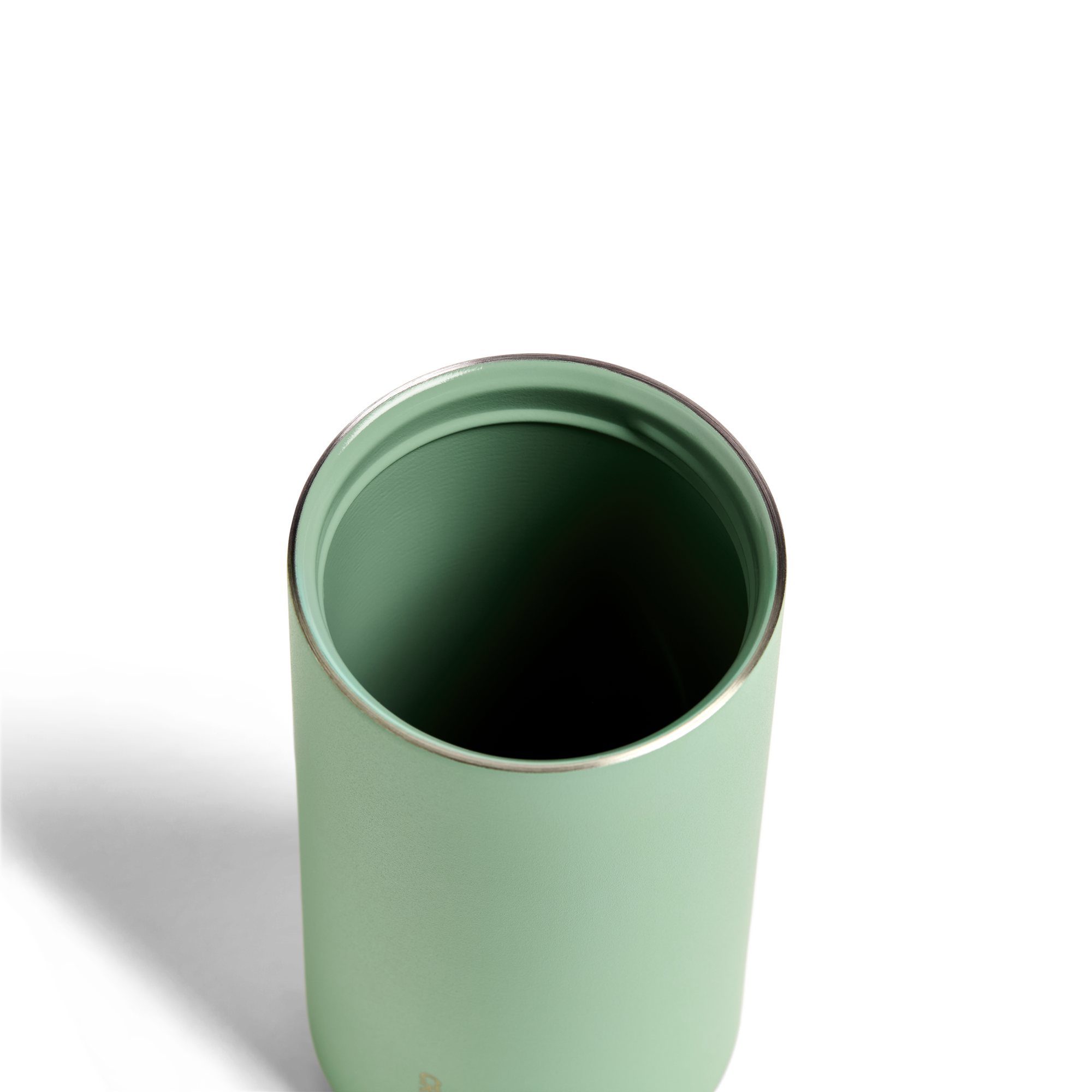 Sage green 12oz Nomad Grip Tumbler by Created Co. with textured grip and stainless steel body, perfect for hot and cold beverages.