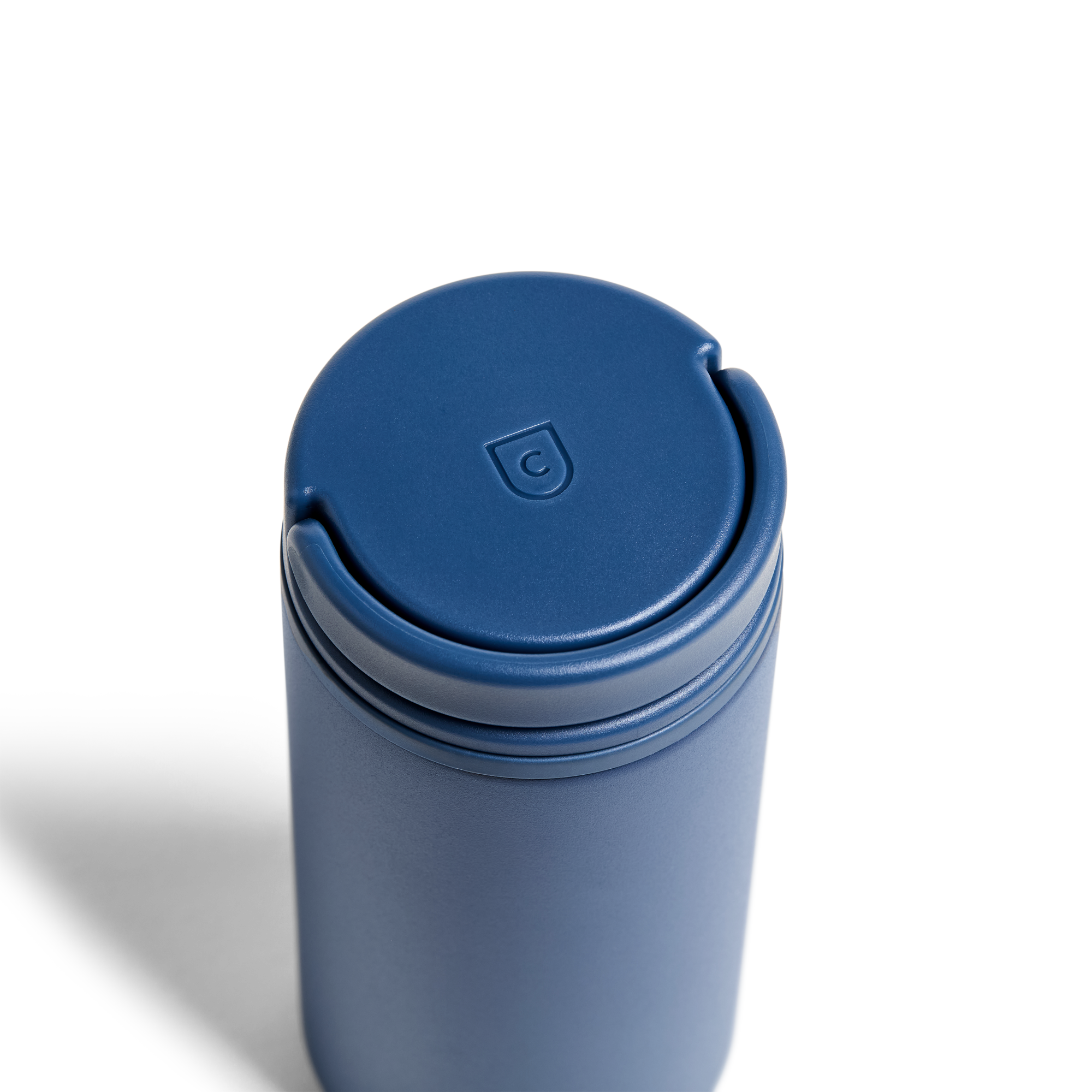Created Co. 12oz Nomad Grip Tumbler in Pacific Blue with textured grip and stainless steel body, designed for hot and cold beverages.
