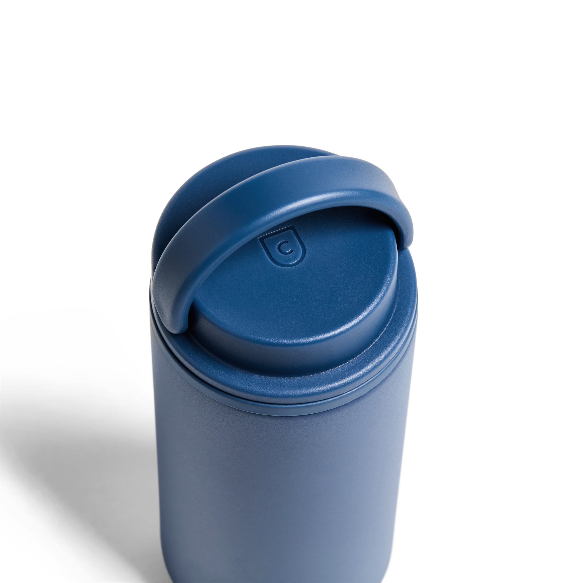 Created Co. 12oz Nomad Grip Tumbler in Pacific Blue with textured grip and stainless steel body, ideal for hot and cold beverages.