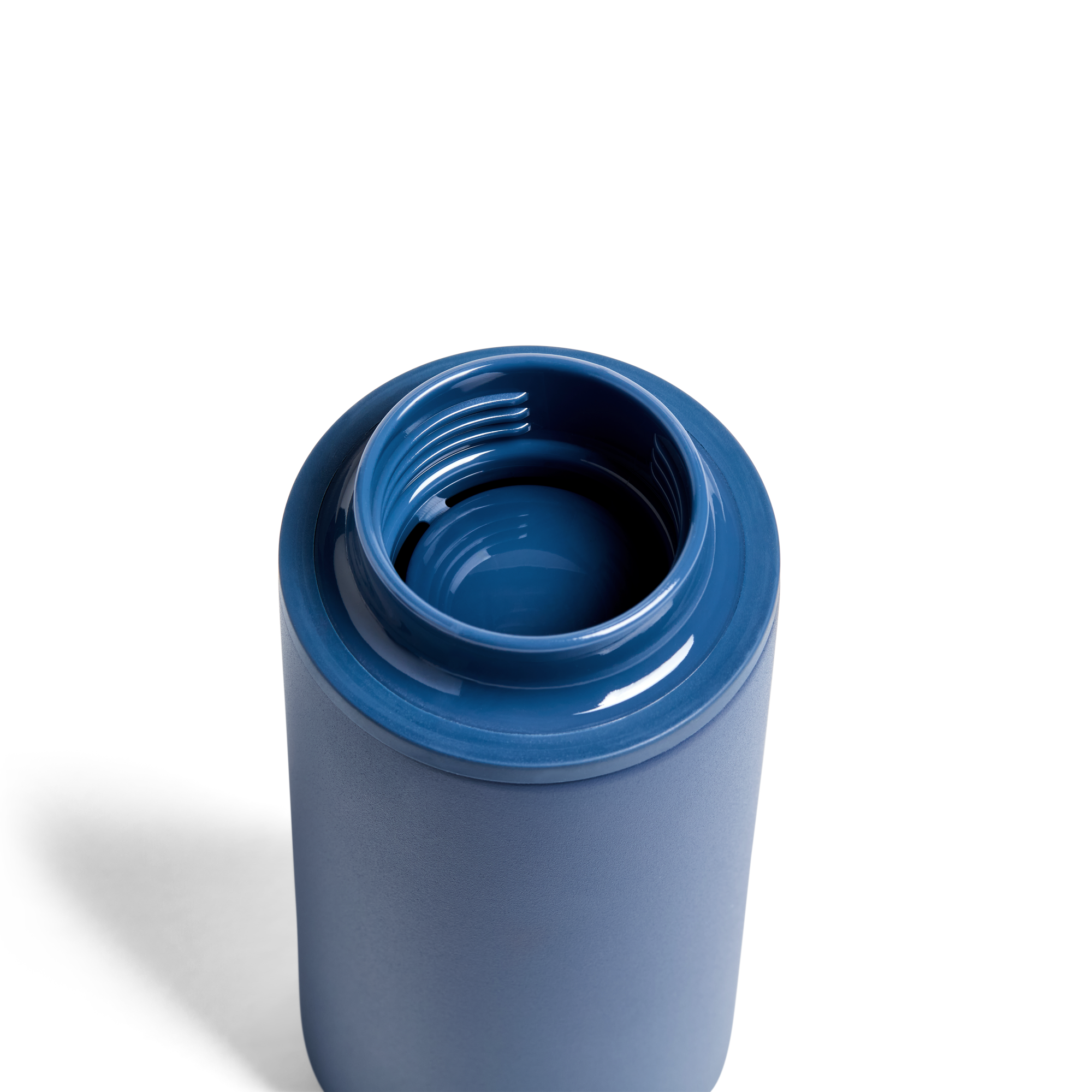 Created Co. 12oz Nomad Grip Tumbler in Pacific Blue with textured grip and stainless steel body, suitable for hot and cold beverages.