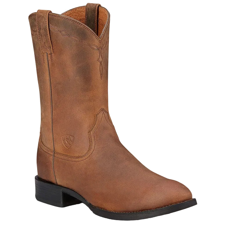 Brown leather boot on a light beige background