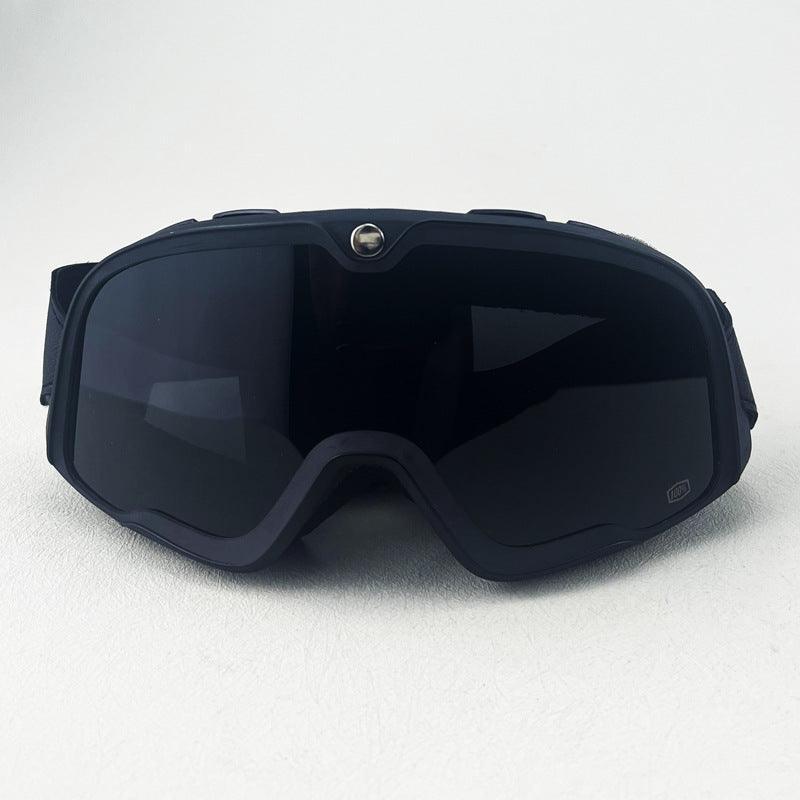 Bean's Moto Booth 100% BARSTOW™ motorcycle goggles with tinted lenses and adjustable strap for helmet riding.