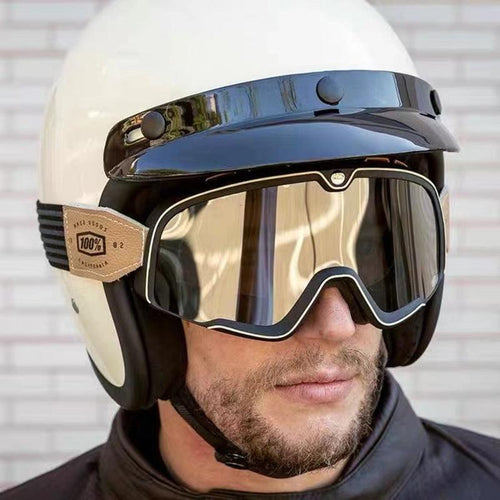 100% BARSTOW™ motorcycle helmet goggles with clear lenses and adjustable strap, designed for motorcycle riding.