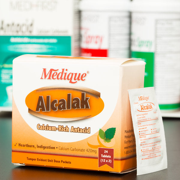 Alcalak medicine box with 24 topical medication packs from Quakekits, featuring labeled packaging and medication containers.