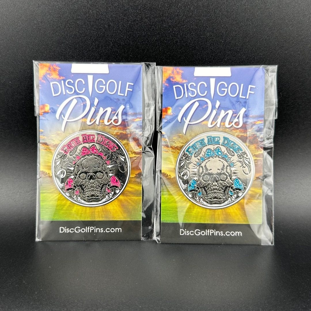 Rare Air Discs Crushin' Amanitas pin in two color options, metal accessory with detailed Amanitas mushroom design.