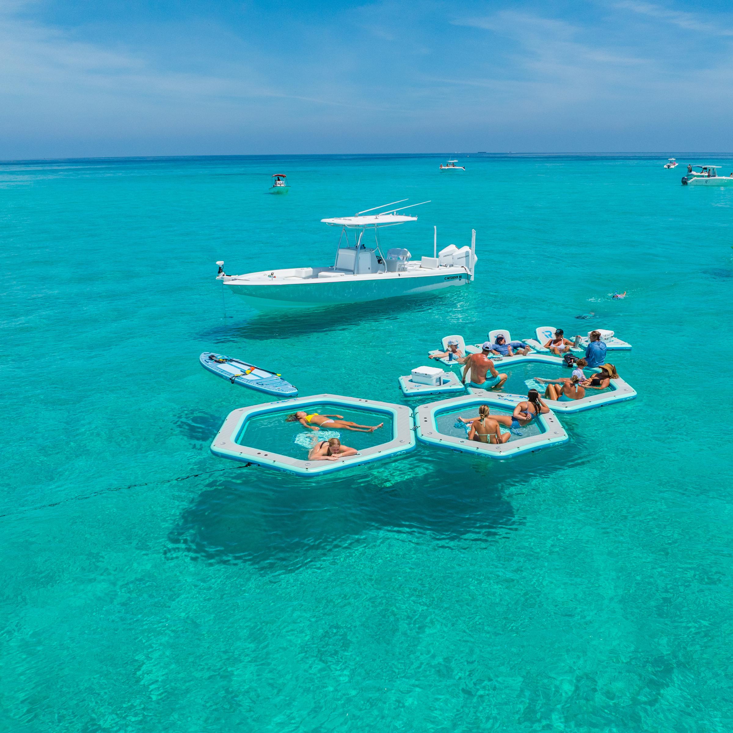 iLAND® 8' inflatable float by iROCKER US, featuring durable construction and vibrant colors for relaxing on the water.