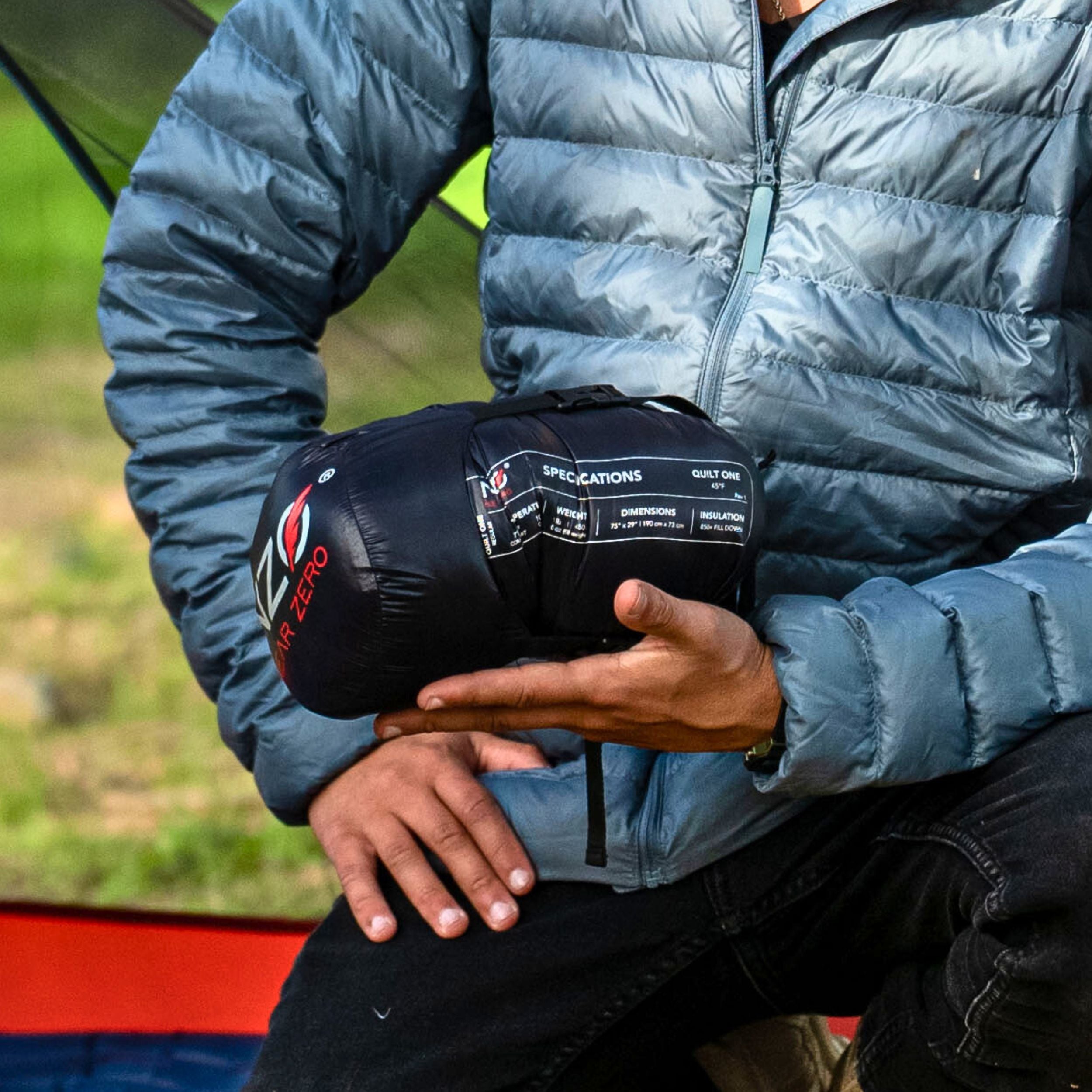 Near Zero Outdoor Gear QUILT ONE sleeping bag with a cozy design, unzipped, showcasing its soft lining and vibrant color.