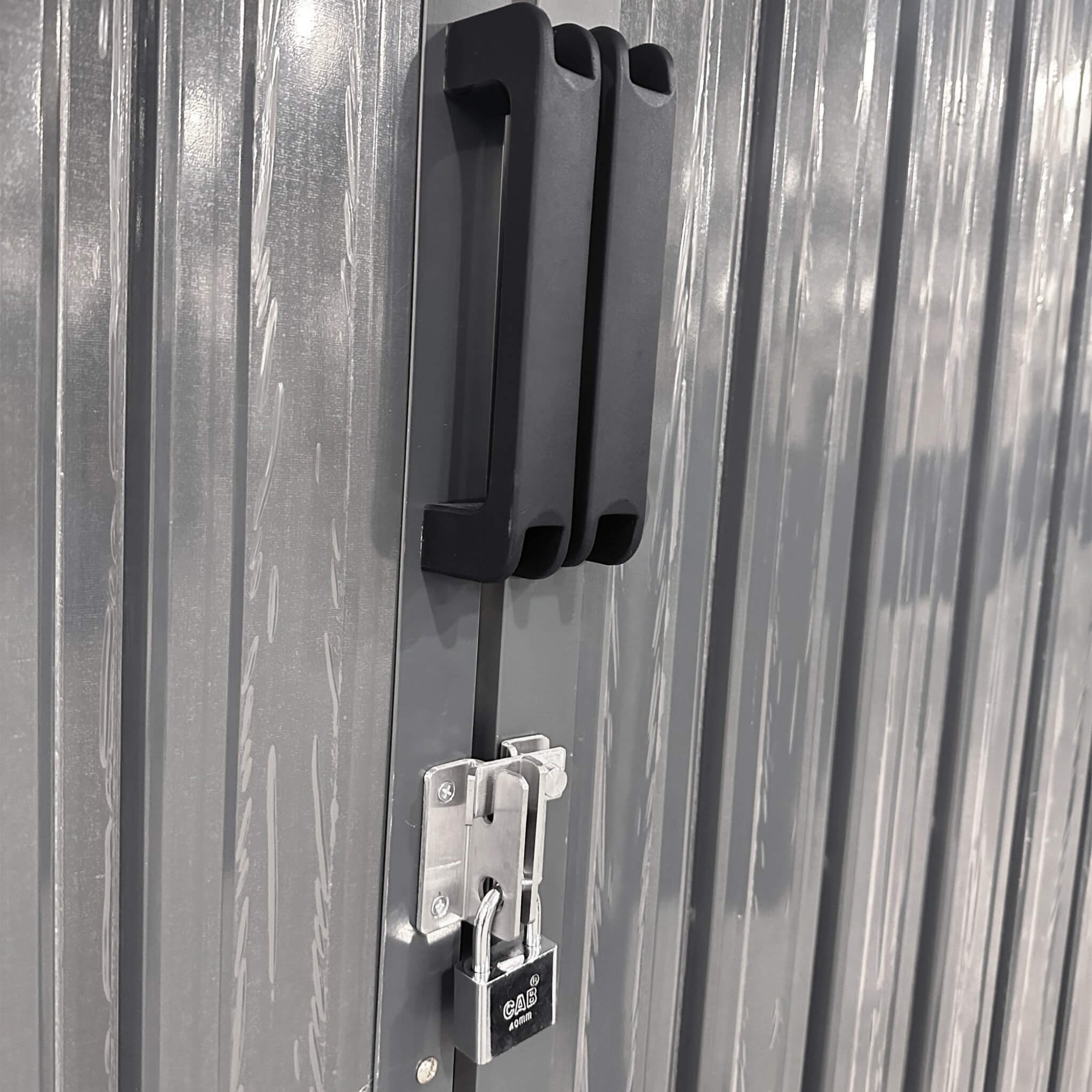 Heavy-duty 10x20ft outdoor utility garage storage shed by SAKSBY WHOLESALE with air vents and door handle detail.