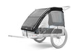Backcountry Sportsman Thule Courier dog trailer kit attached to a bicycle, featuring durable frame and safety features for pet transportation.