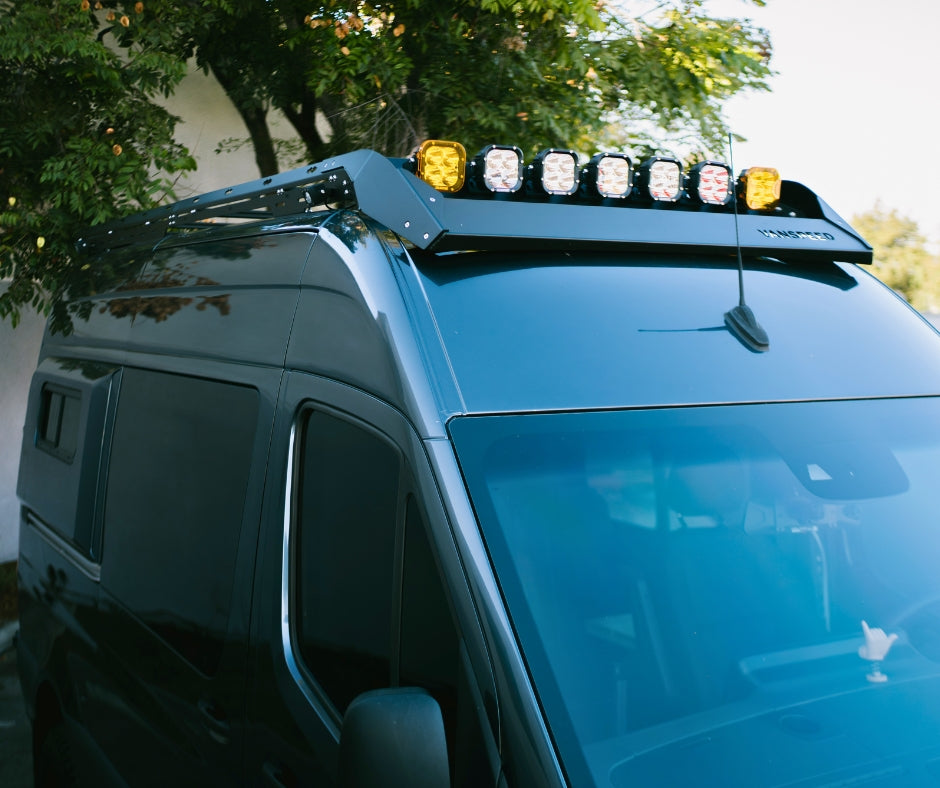 Sprinter Scout Rack 144 by The Van Mart, showcasing a sturdy roof rack on a Sprinter van against a clear sky.