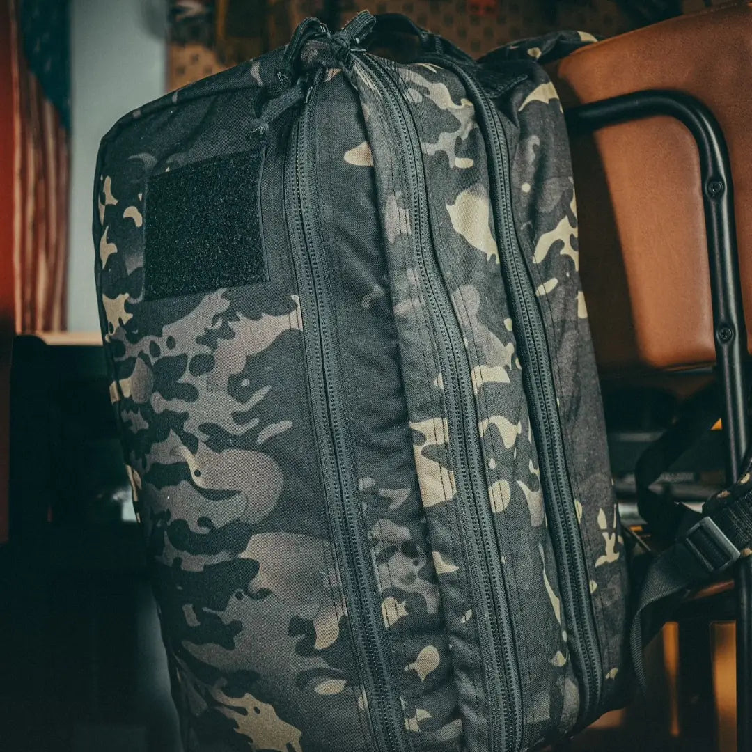 Recycled Firefighter 12 Hour Plus Backpack in durable 500D material, featuring multiple compartments and padded straps for comfort.