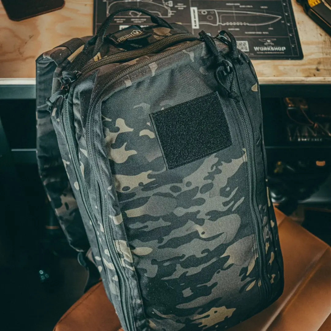 Recycled Firefighter 12 Hour Plus Backpack made of durable 500D material, shown with multiple compartments and sturdy straps.