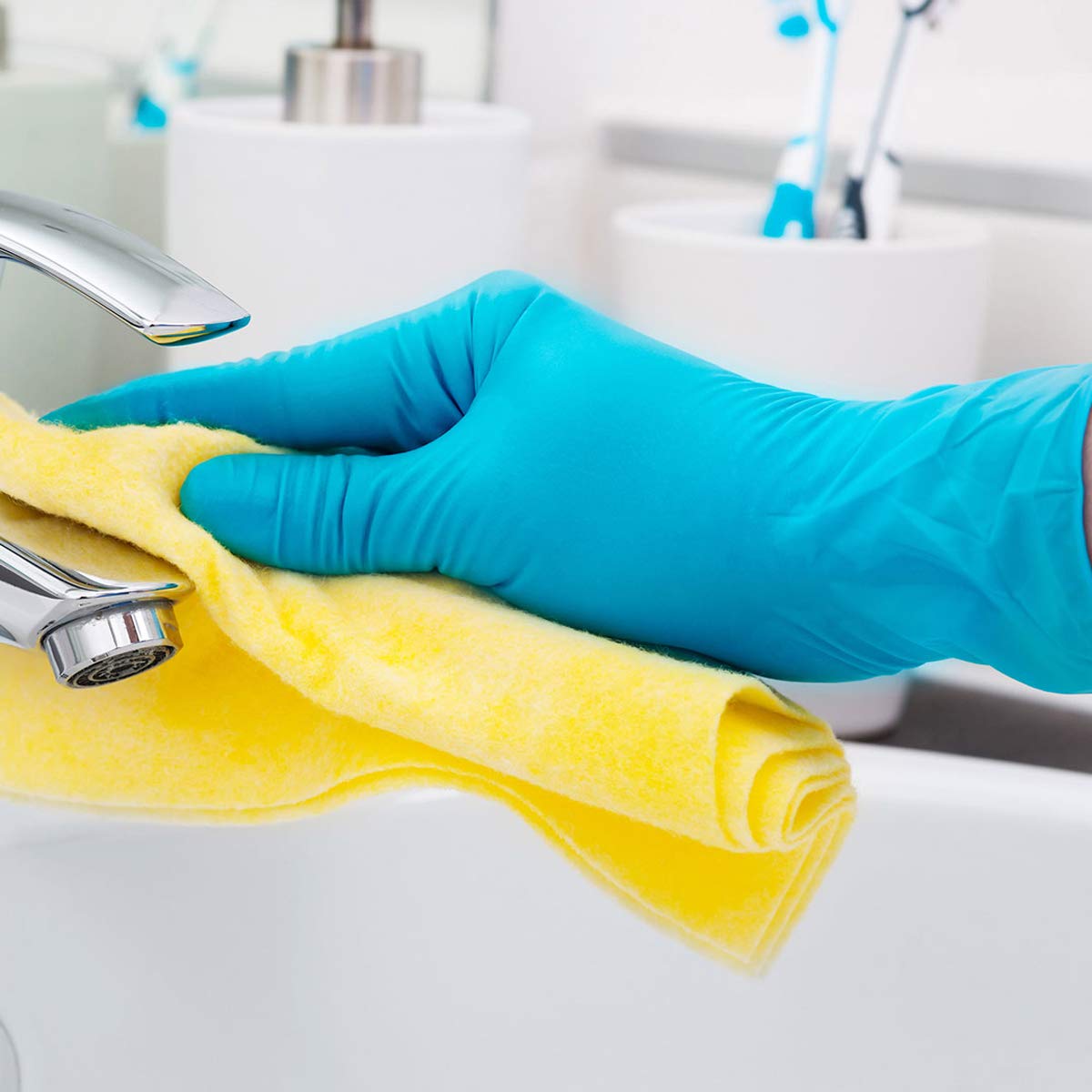 Box of 100 medium nitrile hygiene gloves from quakekits.com, showing a stack of blue disposable gloves on a plain background.