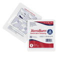 Sterile XeroBurn 4x4 burn dressing used for wound treatment, with absorbent gauze and sterile packaging for effective burn care.