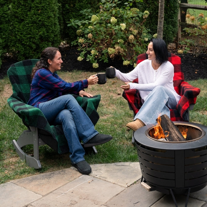 Red plaid Chair Blanket by City Bonfires draped over a chair, cozy and warm for outdoor or indoor use.